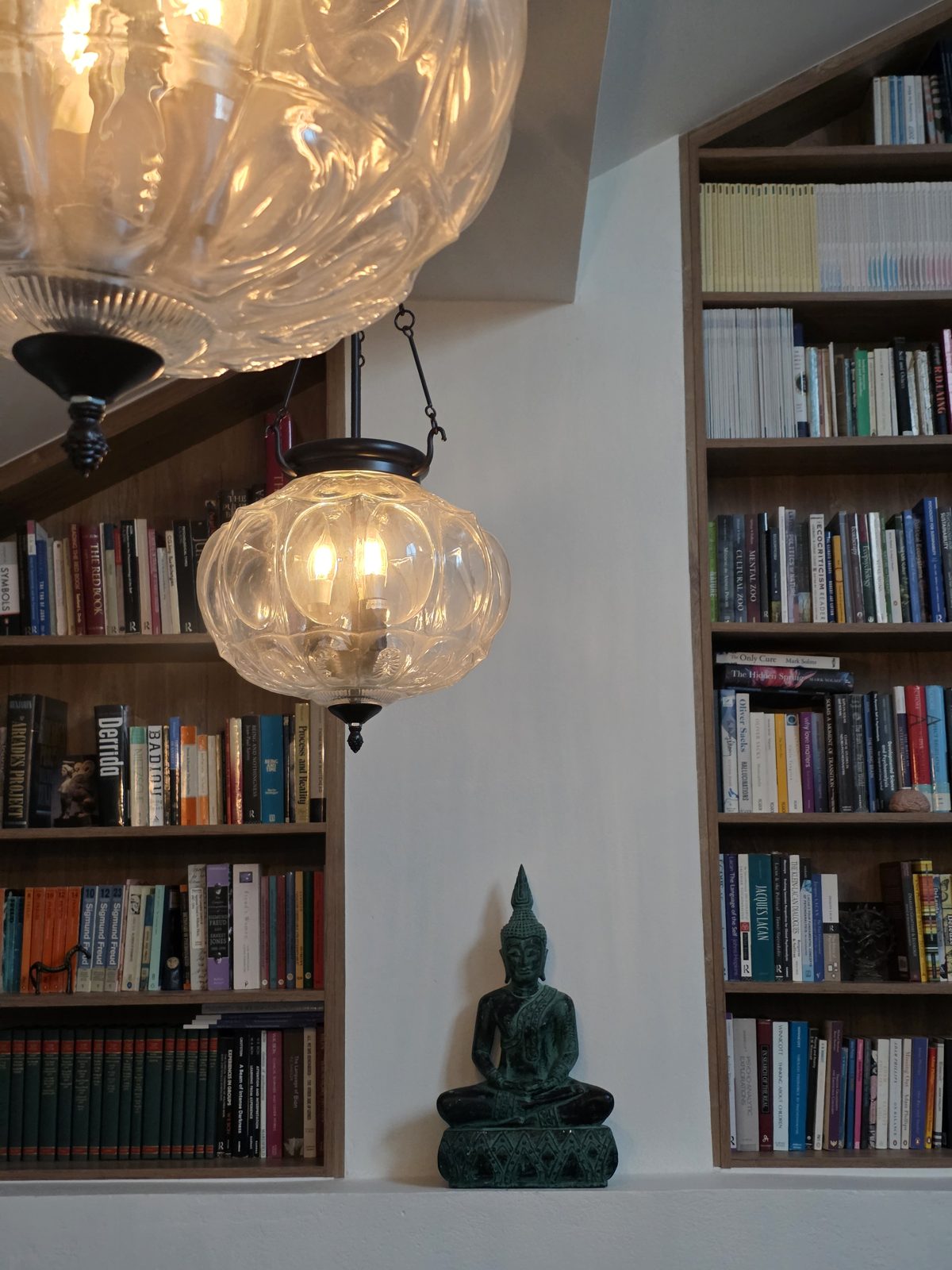 Glass lanterns and bookshelves in the studio
